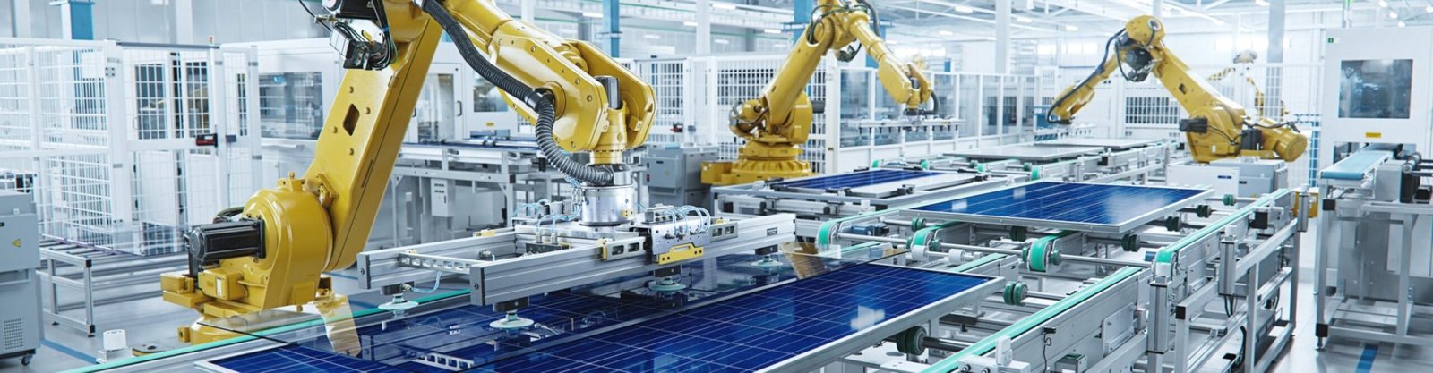 Large Production Line with Industrial Robot Arms at Modern Bright Factory. Solar Panels are being Assembled on Conveyor. Automated Manufacturing Facility